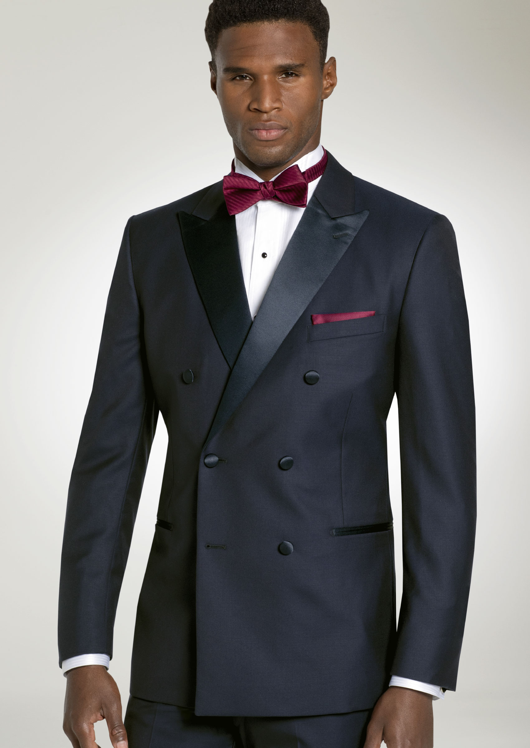 Navy tux with 2025 red bow tie