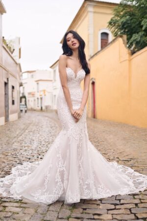 You describe yourself as a sexy romantic. Someone who loves allover lace while still being able to see some skin. You're in luck! This sexy lace bridal gown has all that and more.