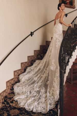 picture of wedding dress on stairs with scallop train